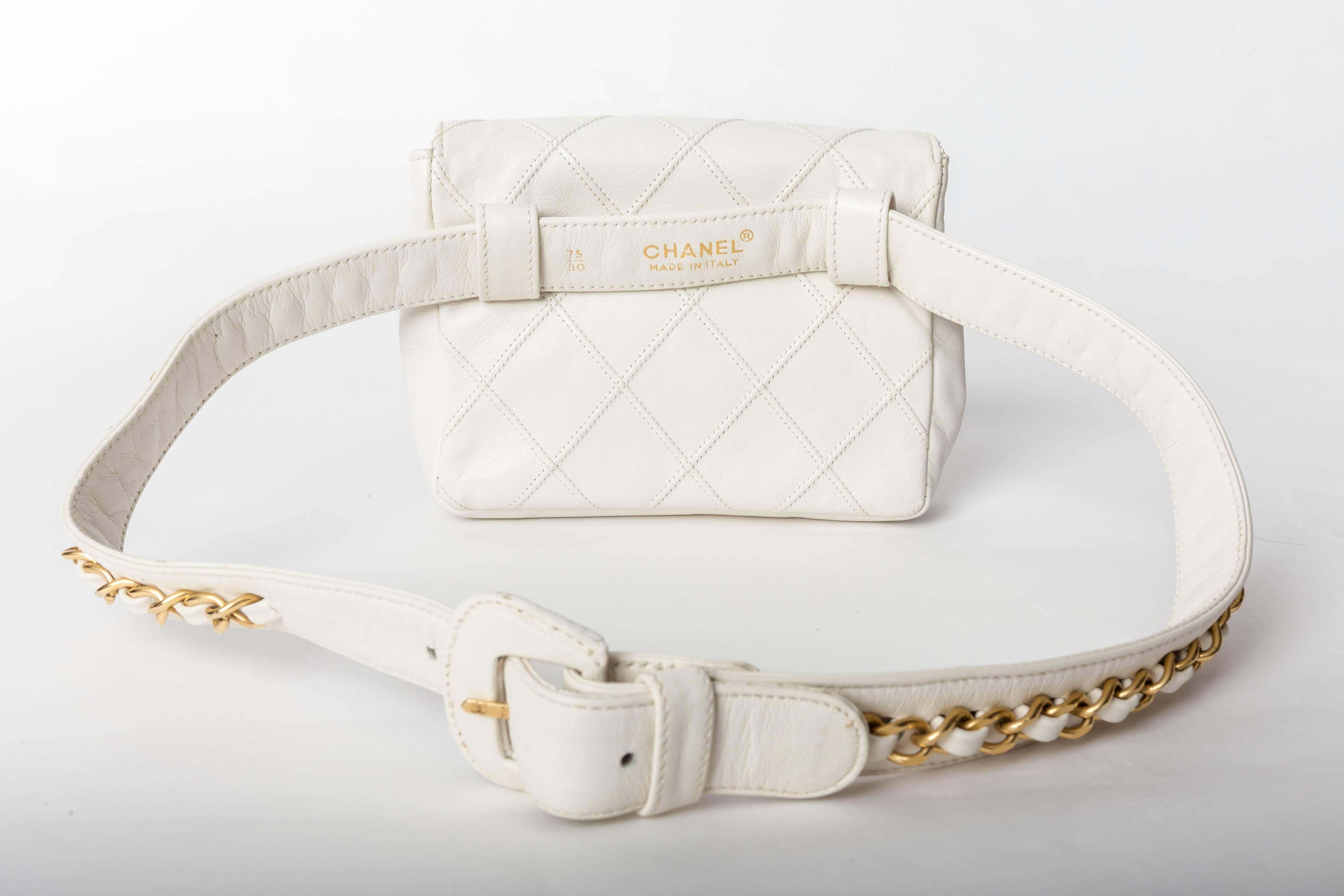 Fabulous Vintage Chanel White Lambskin Fanny Pack with Gold Hardware
Condition is Excellent
Belt Measures 30 Inches / 75 Cm
Fanny Pack Measures 5.5 inches Wide x 4.5 Inches High
Chain Detail to Belt is Quintessential Chanel 
