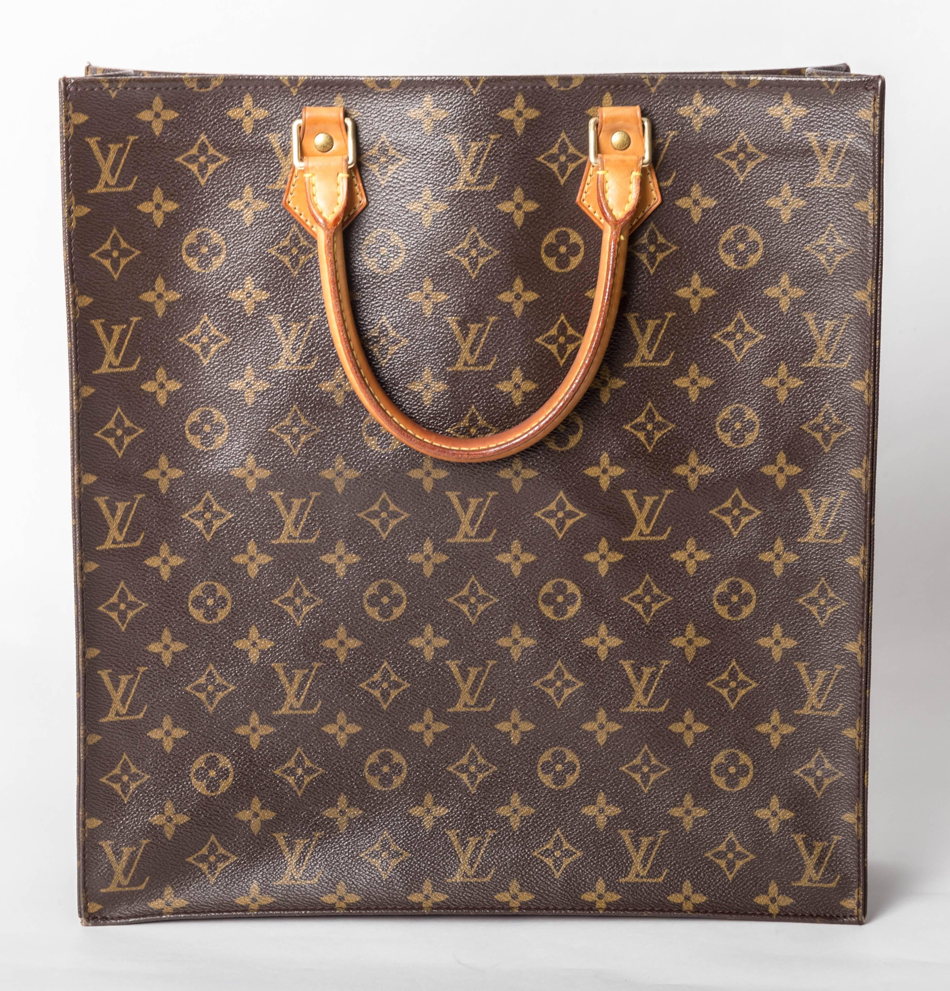 Fabulous Louis Vuitton Sac Plat Tote 
Two interior pockets  
14 inches wide x 15 inches high
Handle drop of 6 inches
A couple of faint ink marks to interior