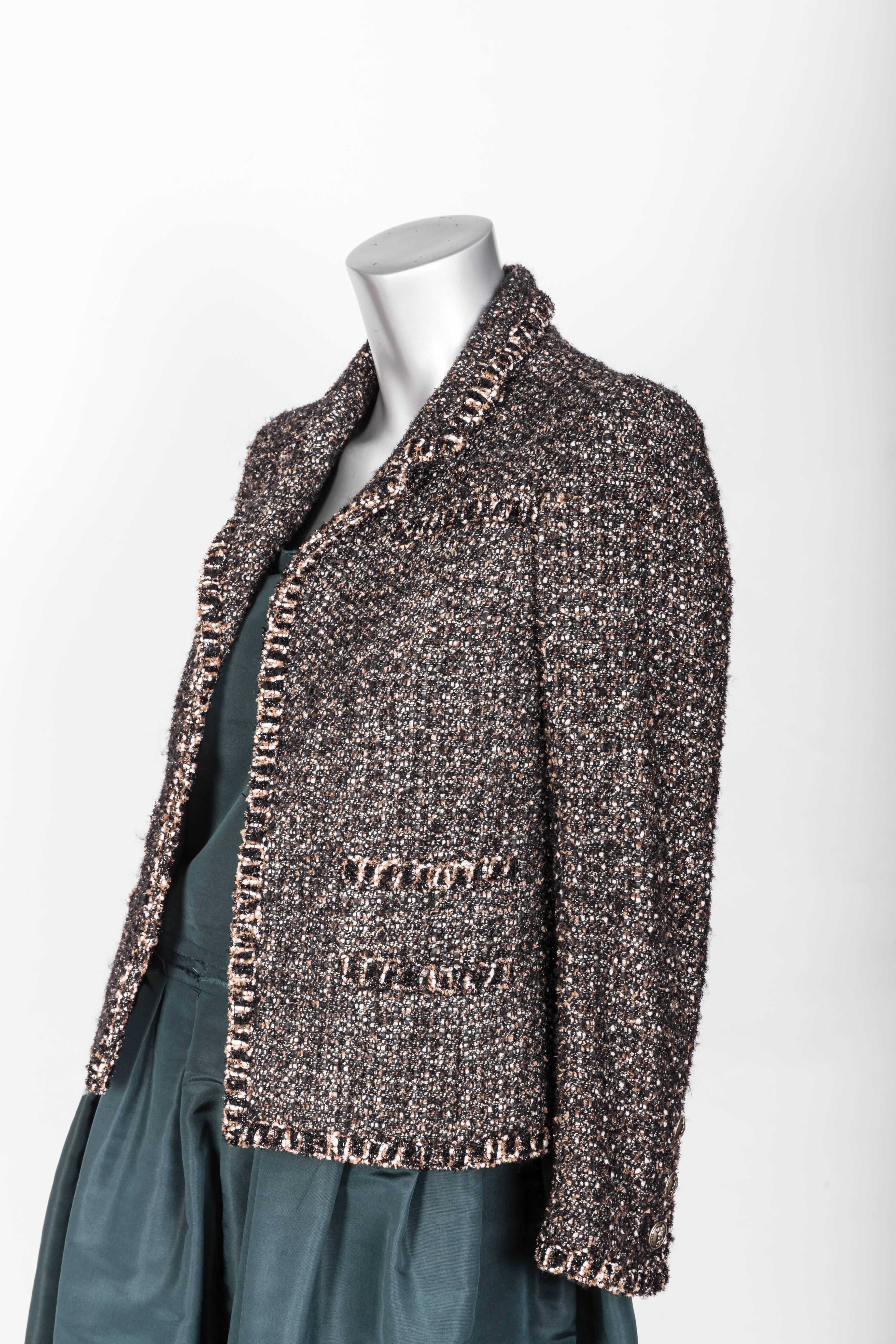 Chic Chanel Tweed Jacket With a Hint of Sparkle - FR 34 / US 2
Hidden Hook and Eye Closure / Single Breasted
Notch Collar
3 Chanel Buttons to Each Cuff
P24398V14928