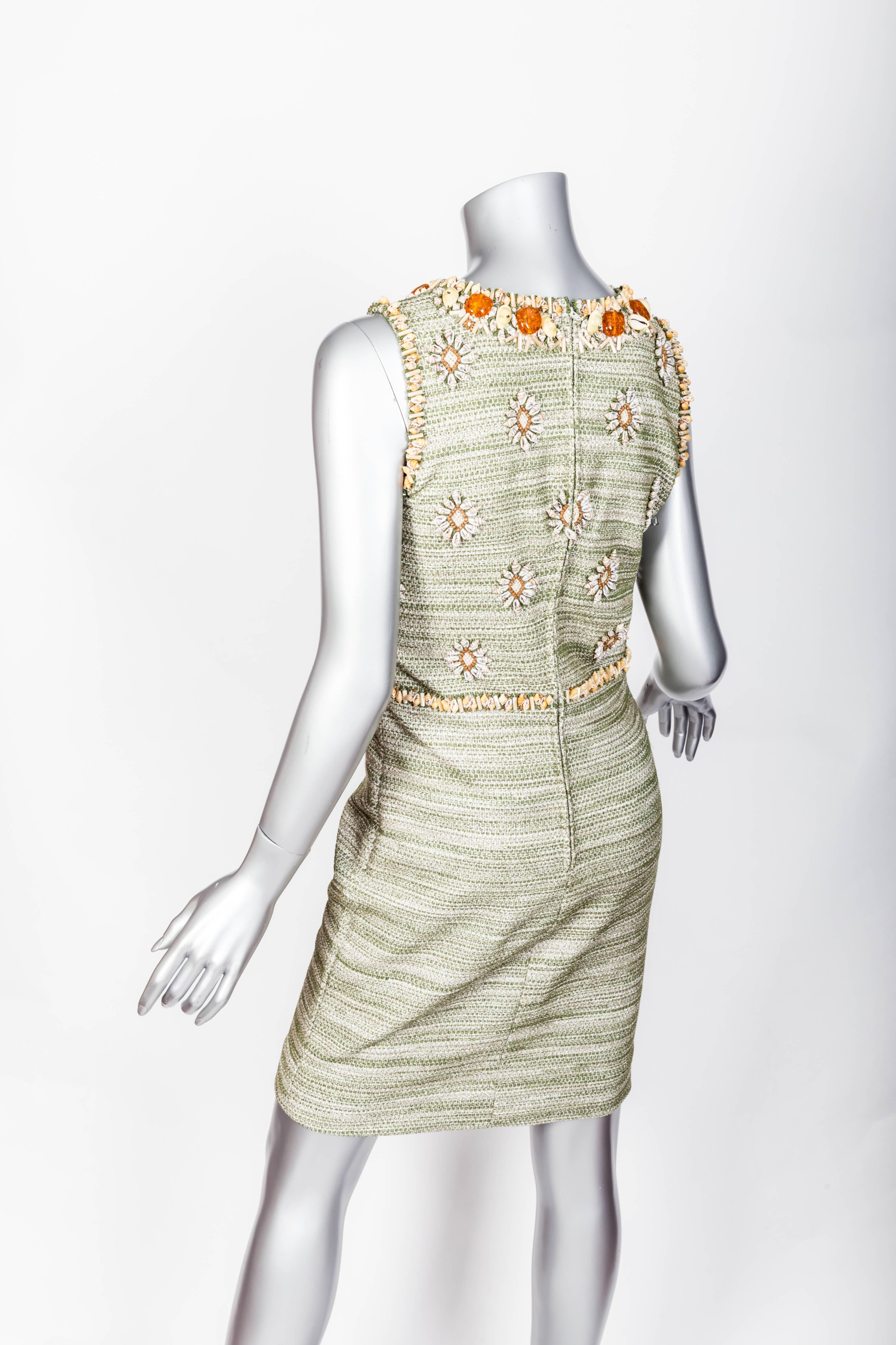 Stunning Oscar de la Renta shift dress in a woven green and white fabric embellished with seashells and some beading.
There is no size tag so please check measurements below.
This dress is in excellent condition and is a true work of art as