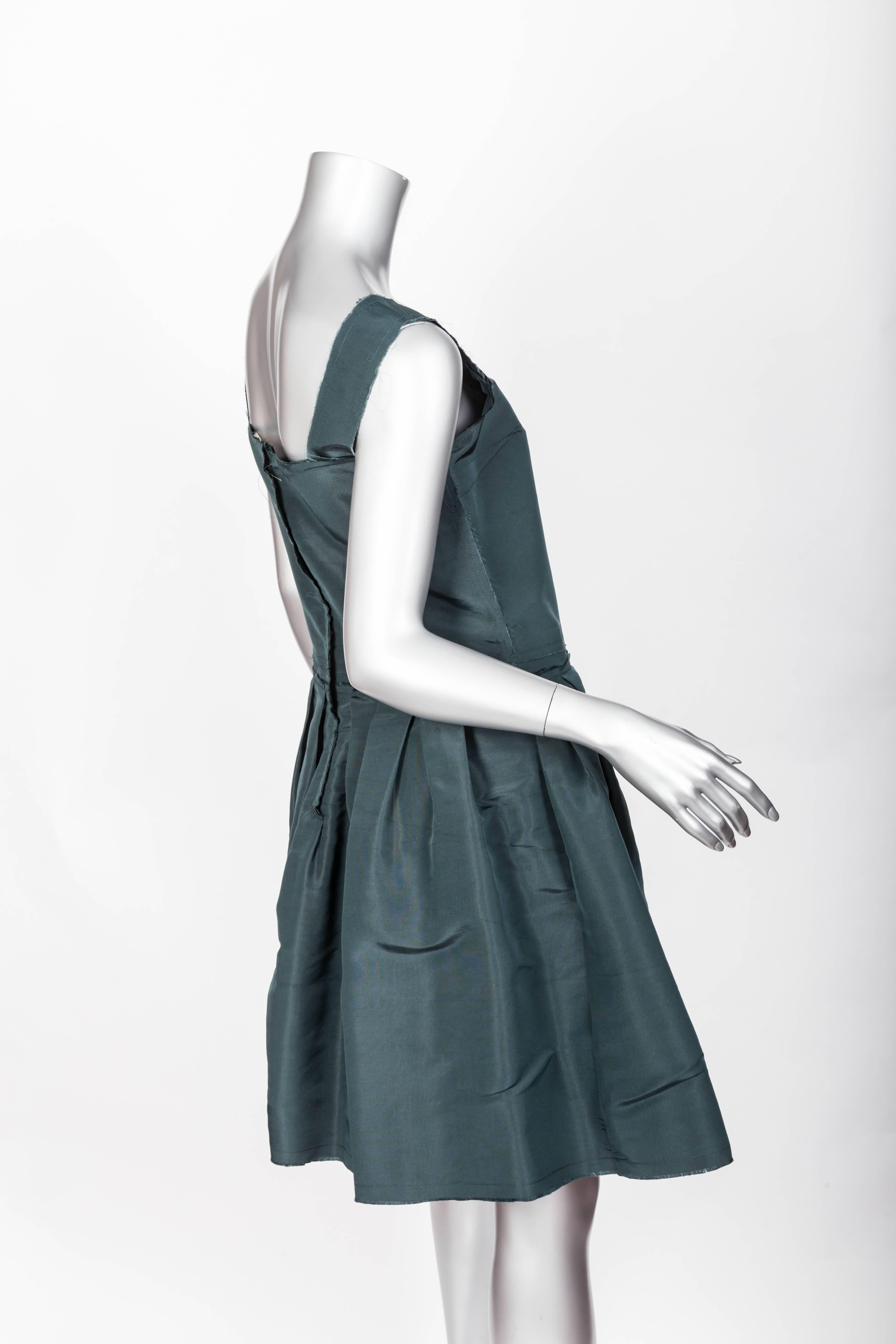 Great Dark Green Silk Lanvin Dress - Size 40
With beautifully raw edges this fabulous Lanvin dress is both chic and great fun.
Condition is Excellent.