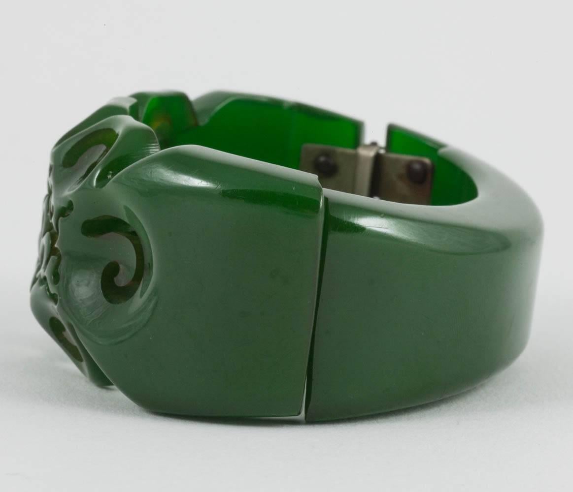 A carved green bakelite clamper bracelet, with stylised floral motif, USA, 1930s In Good Condition For Sale In Greyabbey, County Down