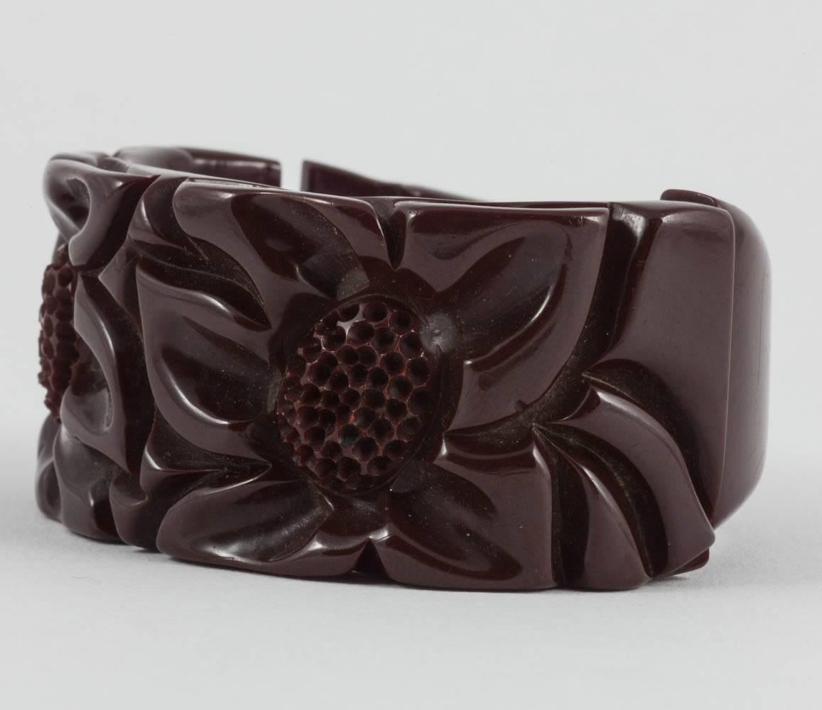 A beautiful hand carved bakelite bracelet, in a warm maroon colour, from the 1930s.
This bracelet is one of three listed this week and all three would look lovely worn altogether, 'stacked' in the celebrated style of Nancy Cunard, or worn
