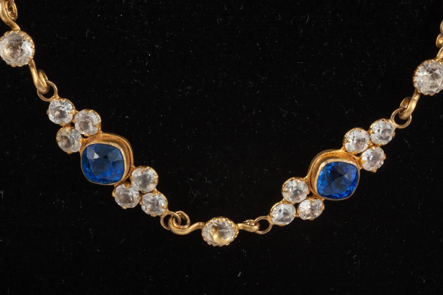 This is a stunning survival of French theatrical jewellery. The paste stones are clear and a most intense cornflower blue. The piece would have been designed for use with different pendants, or attaching to a costume, as it has two sturdy hooks at