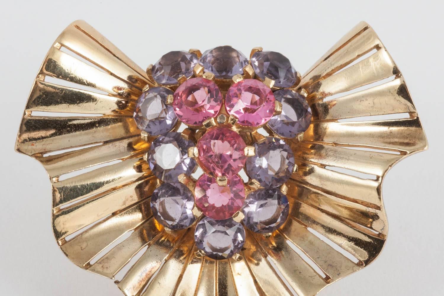 Beautiful abstract design in wave like gilded metal and the softest faceted hues of pink/rose and lilac/amethyst creating a  wonderful 'cocktail' brooch from Marcel Boucher in the 1940s. Signed on the reverse with the MB Phrygian symbol. An ideal