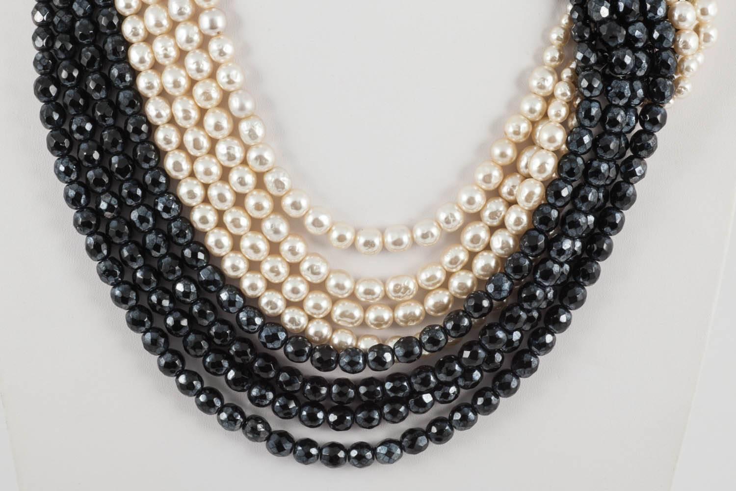 A wonderfully stylish and glamourous necklace from Coppola e Toppo,  featuring a beautiful 'twist' between the two elements of half crystal faceted beads and glass baroque pearls, a wonder of design and structure. Highly collectable and
