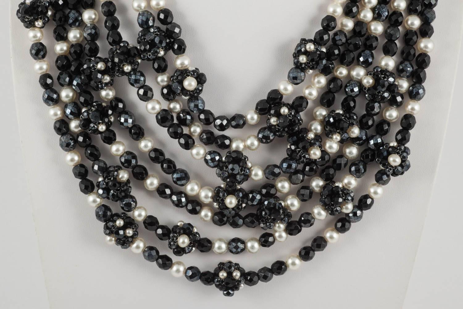 An important and statement seven row necklace from Coppola e Toppo, Milan, made with their signature bead encrusted clasp, and the unusual element of handwoven beaded 'balls' interspersed through the rows, also made of black beads and pearls. A