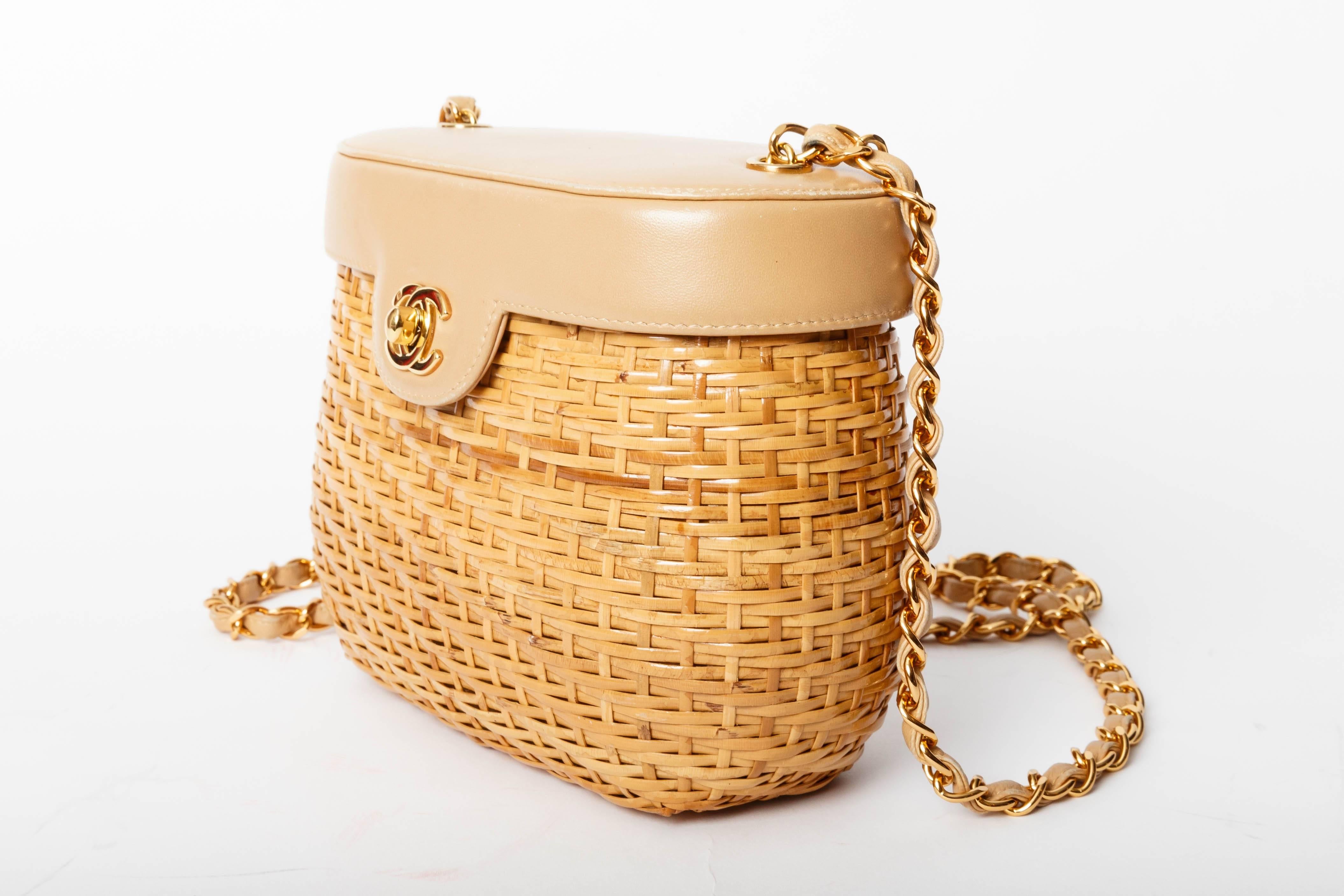 Fabulous CHANEL Vintage Tan Lambskin and Straw Bag with Gold Hardware. 
Features a gold chain shoulder strap with gold Chanel CC Mademoiselle turn lock. 
Condition is excellent.
There is no hologram or accompanying authenticity card with this piece