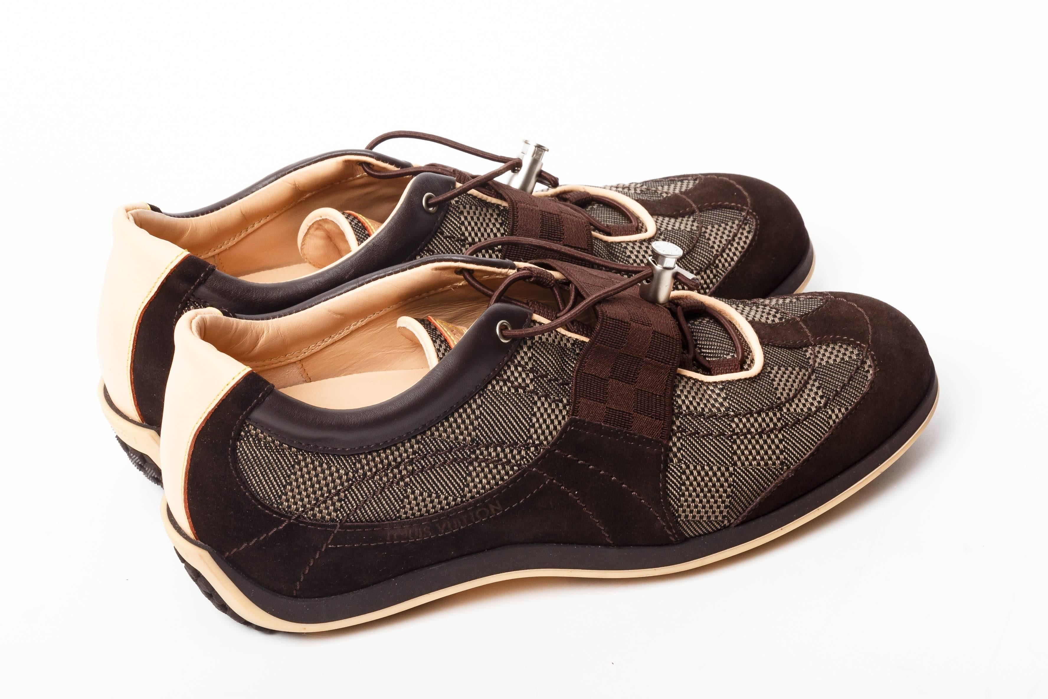 Chic Louis Vuitton Sneakers with brown suede accents 
These sneakers have never been worn.