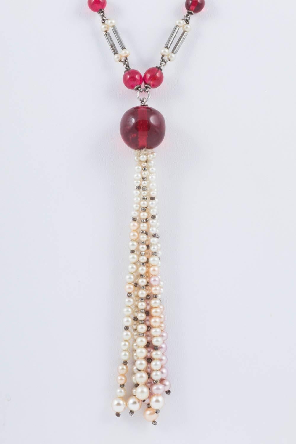 This necklace is possibly French, and has the beautiful cranberry glass bead work normally attributed to Louis Rousselet. As it has no clasp it is difficult to tell. The pearl tassel is interesting because the pearls are a softly graded mix of