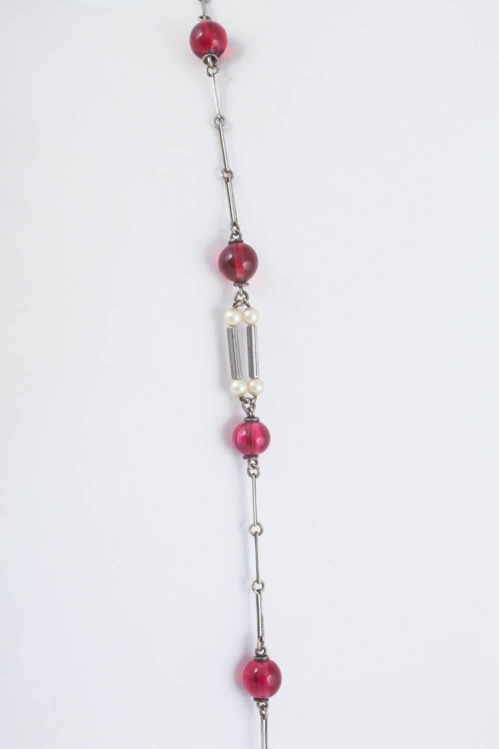 Art Deco cranberry glass and pearl sautoir, with unmarked silver links.  2