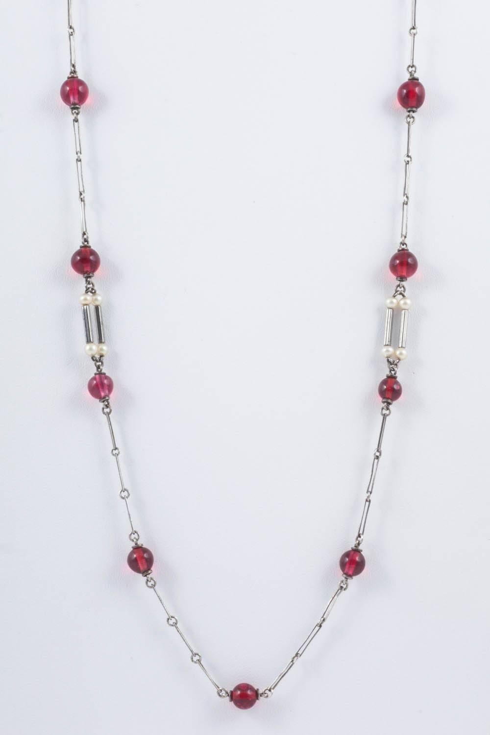 Art Deco cranberry glass and pearl sautoir, with unmarked silver links.  3