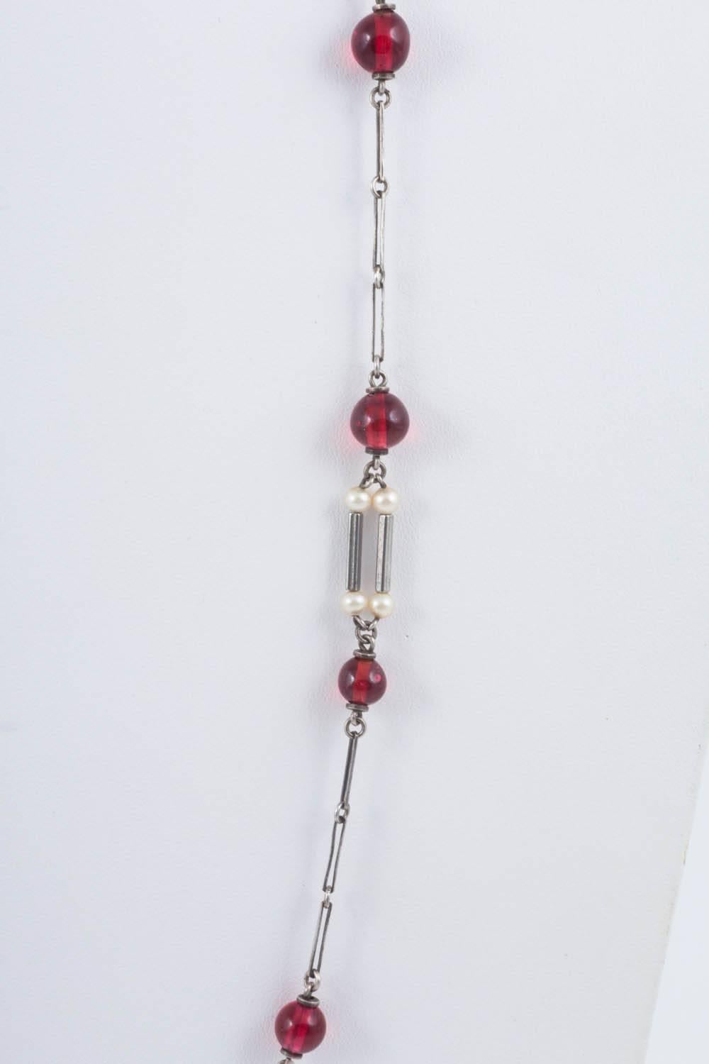 Art Deco cranberry glass and pearl sautoir, with unmarked silver links.  4