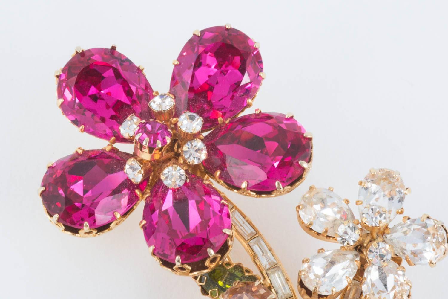 These beautiful and glamorous brooch was made by Schoffel and Co, one of the finest manufacturers of costume jewellery in the 1950s. With vivid clear colour and multifaceted cuts, giving a depth to each stone, this spray catches the light and