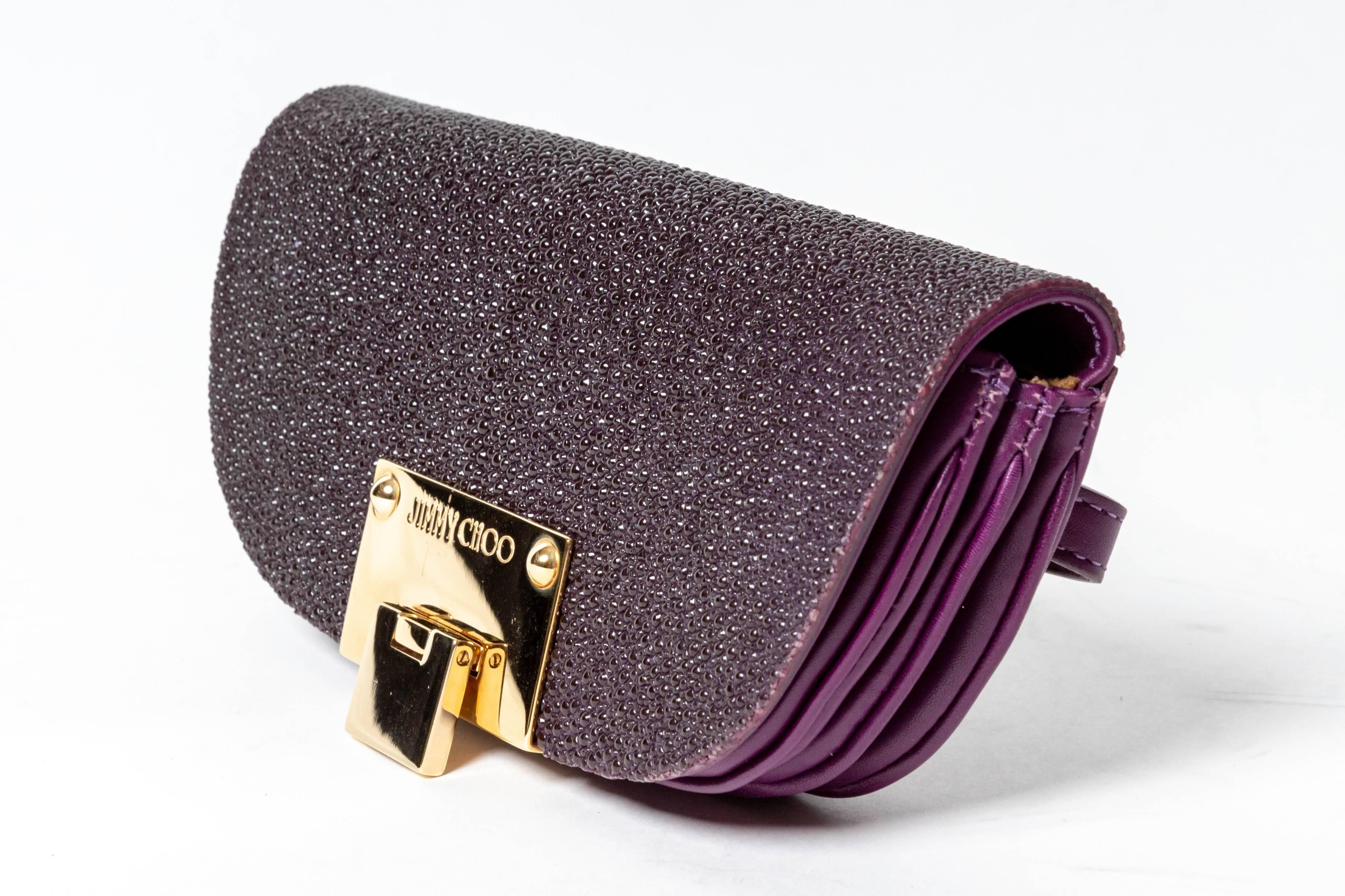 Fabulous Jimmy Choo Purple Stingray / Shagreen Clutch /  Wristlet with Gold Hardware
Suede lining
Condition is excellent
Faint scratches to hardware
