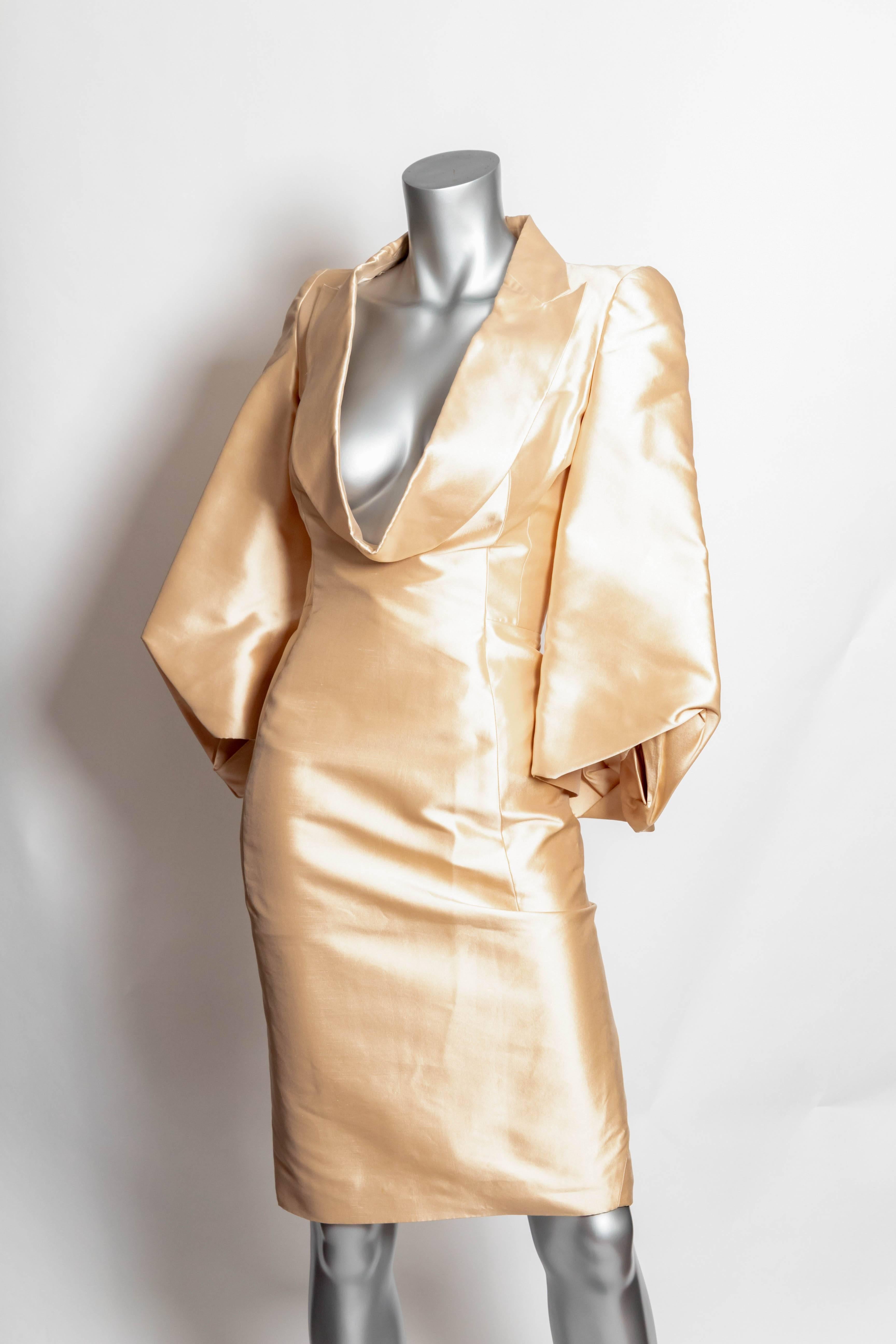 Incredibly chic John Galliano dress with bell sleeves and  deep cowl neck.
Back zip.
Measures 39 1/2 inches from shoulder to hem.
Sleeves measure 22 inches from shoulder seam to longest point.
Condition is excellent.