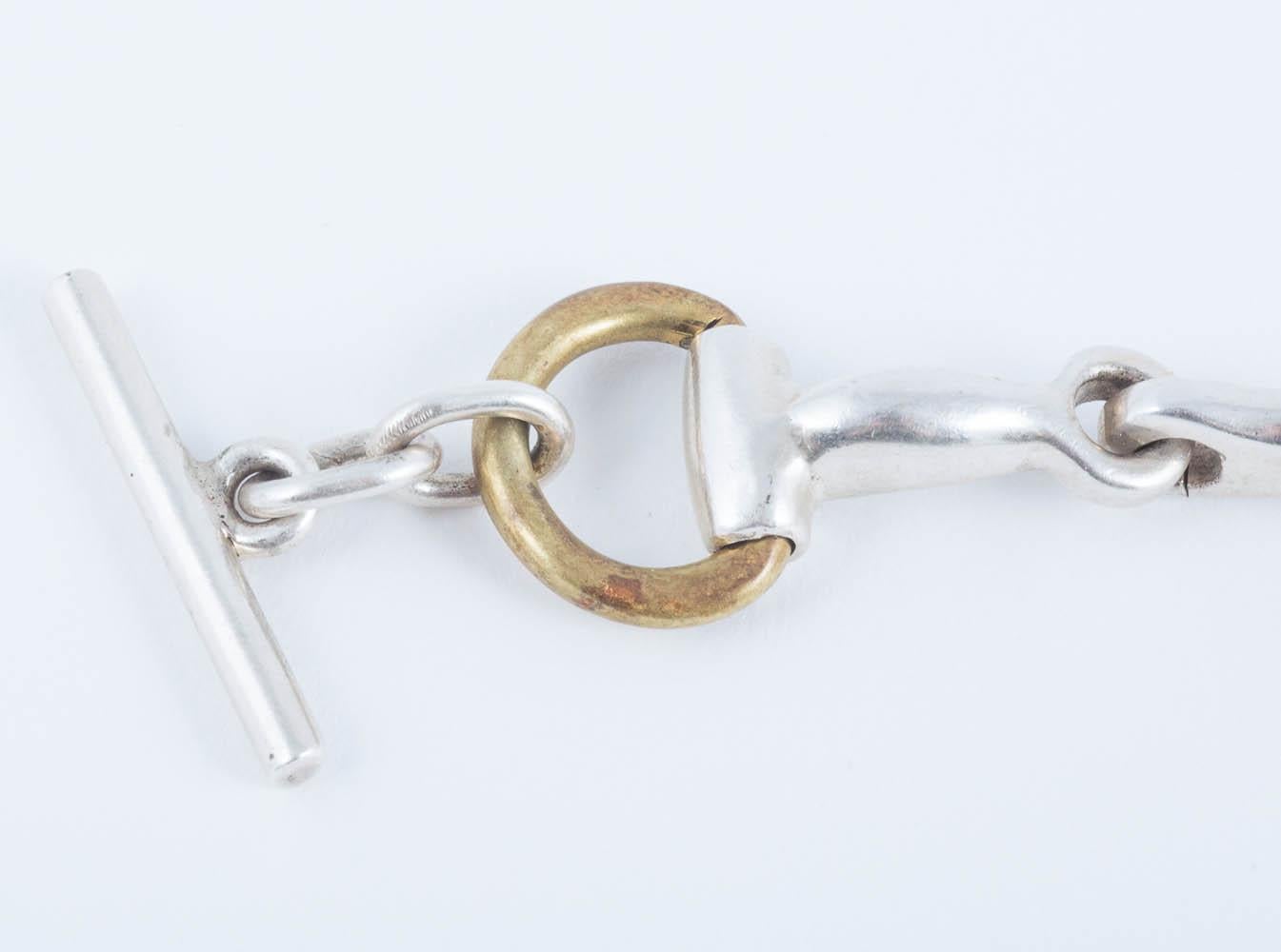 Handwrought sterling silver and brass pair of 'horsebit' bracelets, Mexican, 1970 4