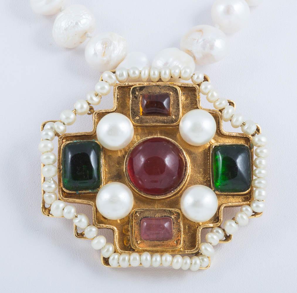 This fantastic signed but not dated Chanel brooch is a classic. It seems likely that this piece was from the 1970s or 1980s, as after that most marks include the date and collection symbol.
It has an opulent baroque look, highly distinctive of