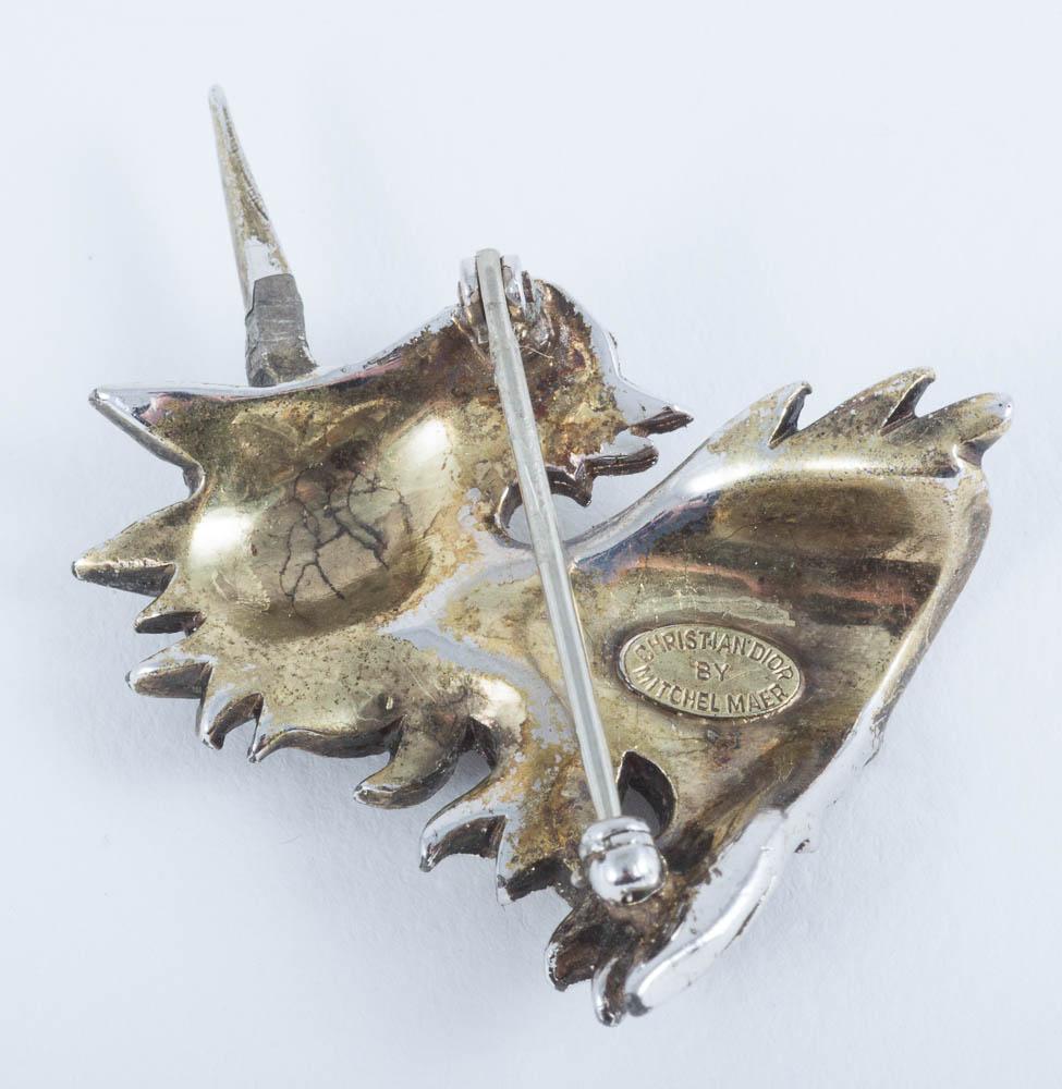 A pair of paste and gilt metal 'unicorn' brooches, Christian Dior, c1954. 4