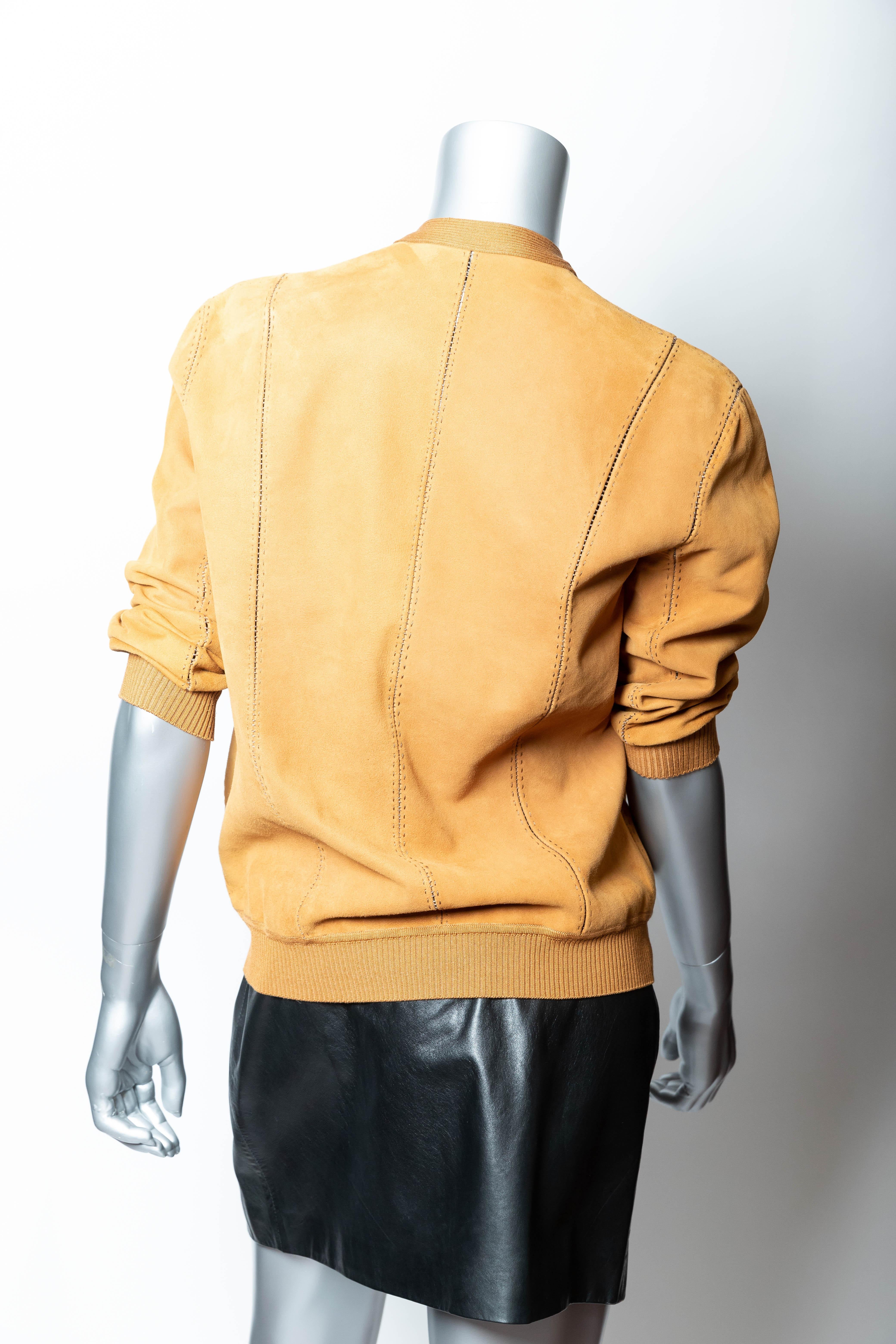 Wonderful Hermes Suede Jacket / Top in Butterscotch.
Reminiscent of the golf sweaters worn in the 1970s.
3/4 sleeves.
Ribbed trim to hem, center and cuffs.
Very good condition. 
