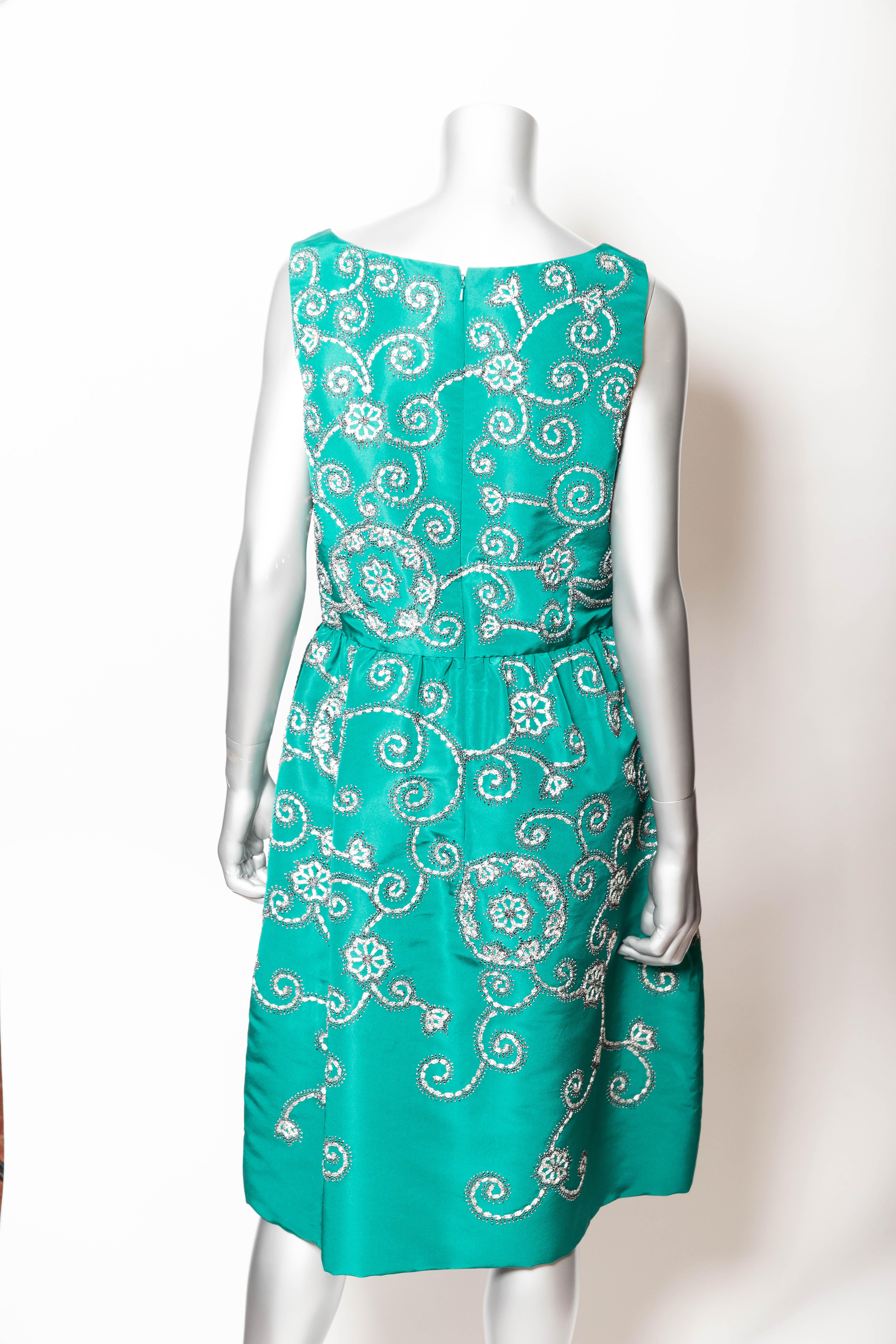 Stunning sleeveless Oscar de la Renta dress in jade green silk.
This dress is new with tags / original retail price of $5690.
Both embroidered and beaded, this dress has a back zip.
