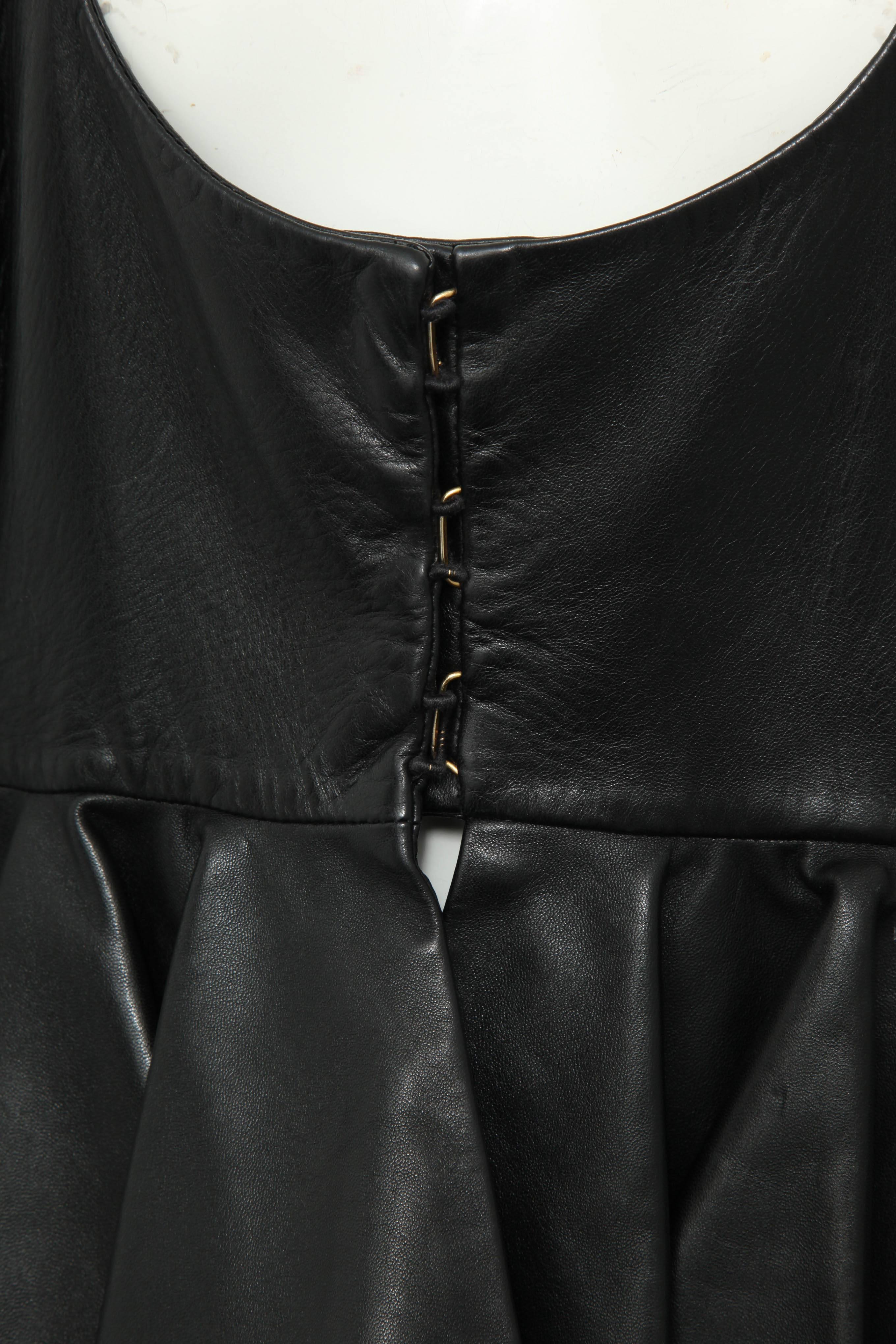 Alexander McQueen Lamb skin leather jacket in black. It has beautiful details in the waist. Size 42.