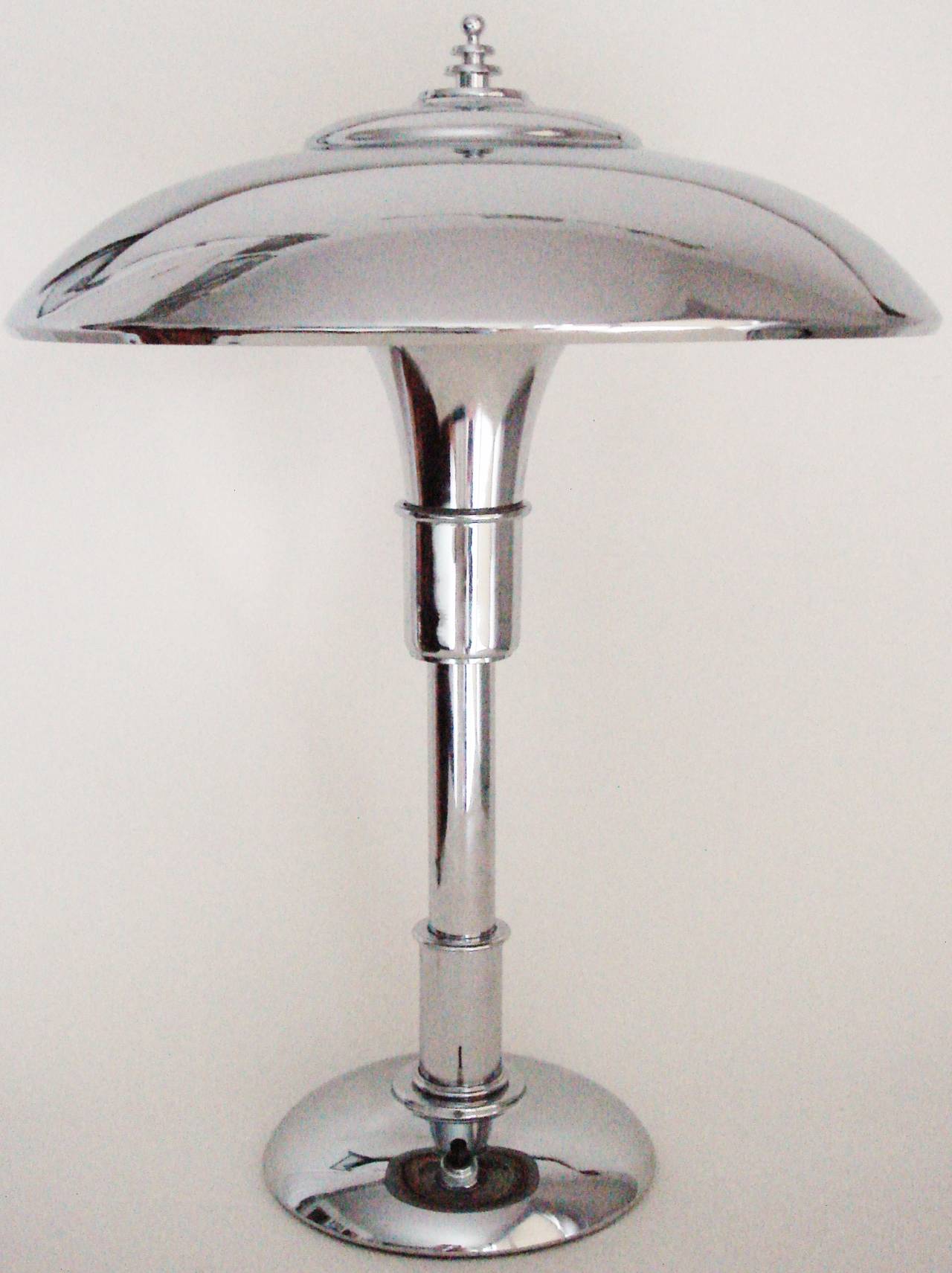 These three beautifully restored and rewired American Art Deco chrome plated iconic Guardsman Junior table lamps were designed in 1936. The prolific designer, Bert  A. Dickerson was awarded a patent for the design (D104 094) the following year and