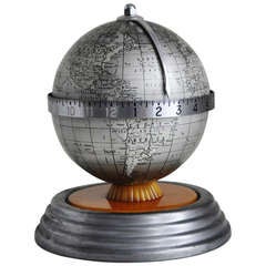 American Art Deco Electric World Clock Desk Top Globe in Lithographed Tin and Butterscotch Bakelite