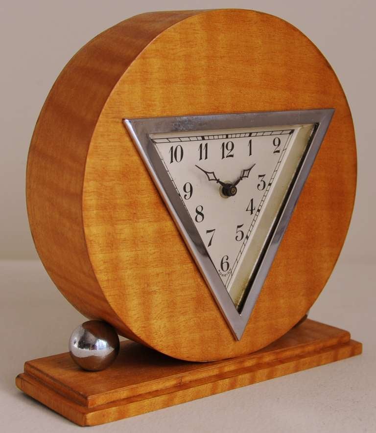 This German Art Deco chrome and striped blonde veneered table clock is a veritable riot of geometric shapes! It is marked 'Foreign' just below the '6' on the dial signifying a clock exported from Germany to England between the wars.
