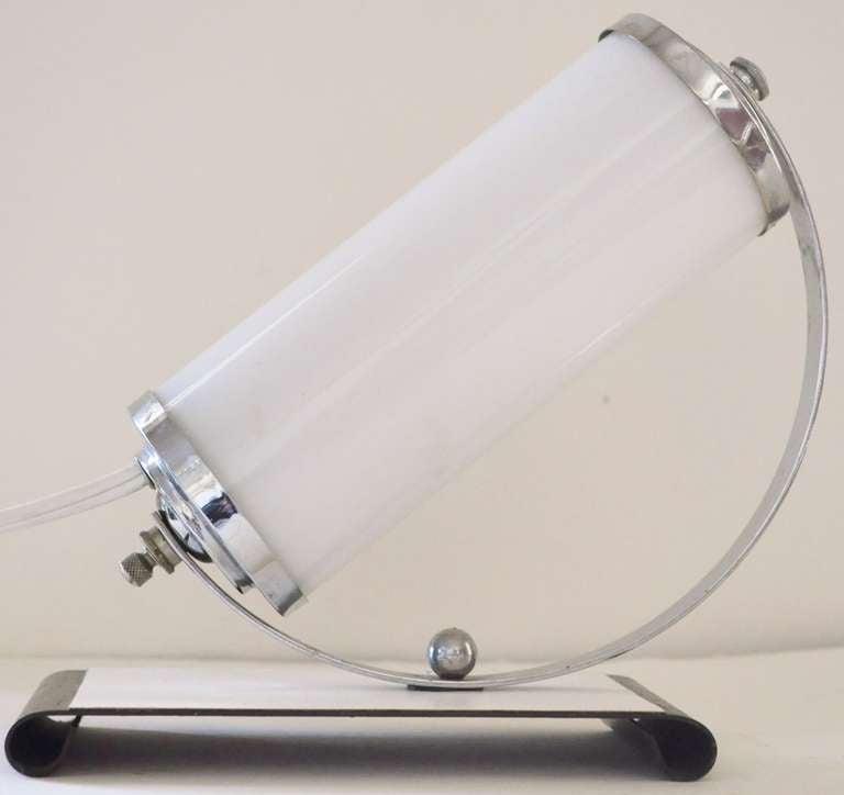 This very stylish pair of American Art Deco Chrome with milk glass angled boudoir or table lamps are accented with chocolate and white enamel to the base. They are near mint original condition and have been rewired.