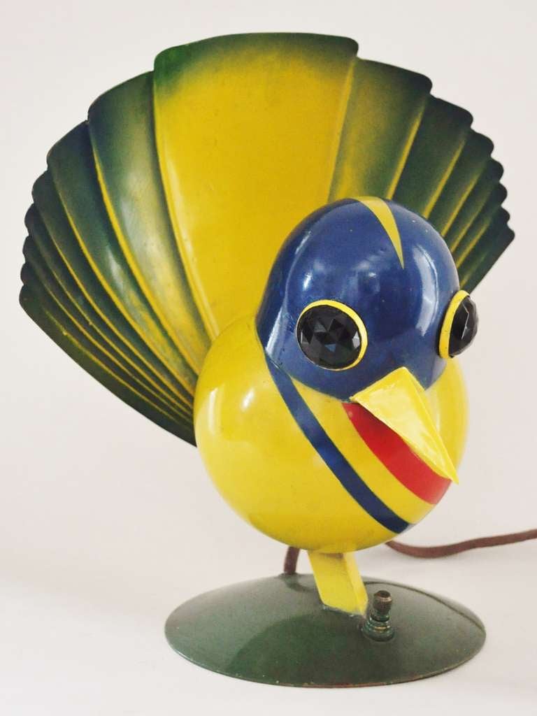 This delightful and very rare American Art Deco Peacock table lamp is attributed to the Miller Lighting Company circa 1929. When illuminated the light shines through the green faceted glass eyes and is reflected back off the tail. It retains its