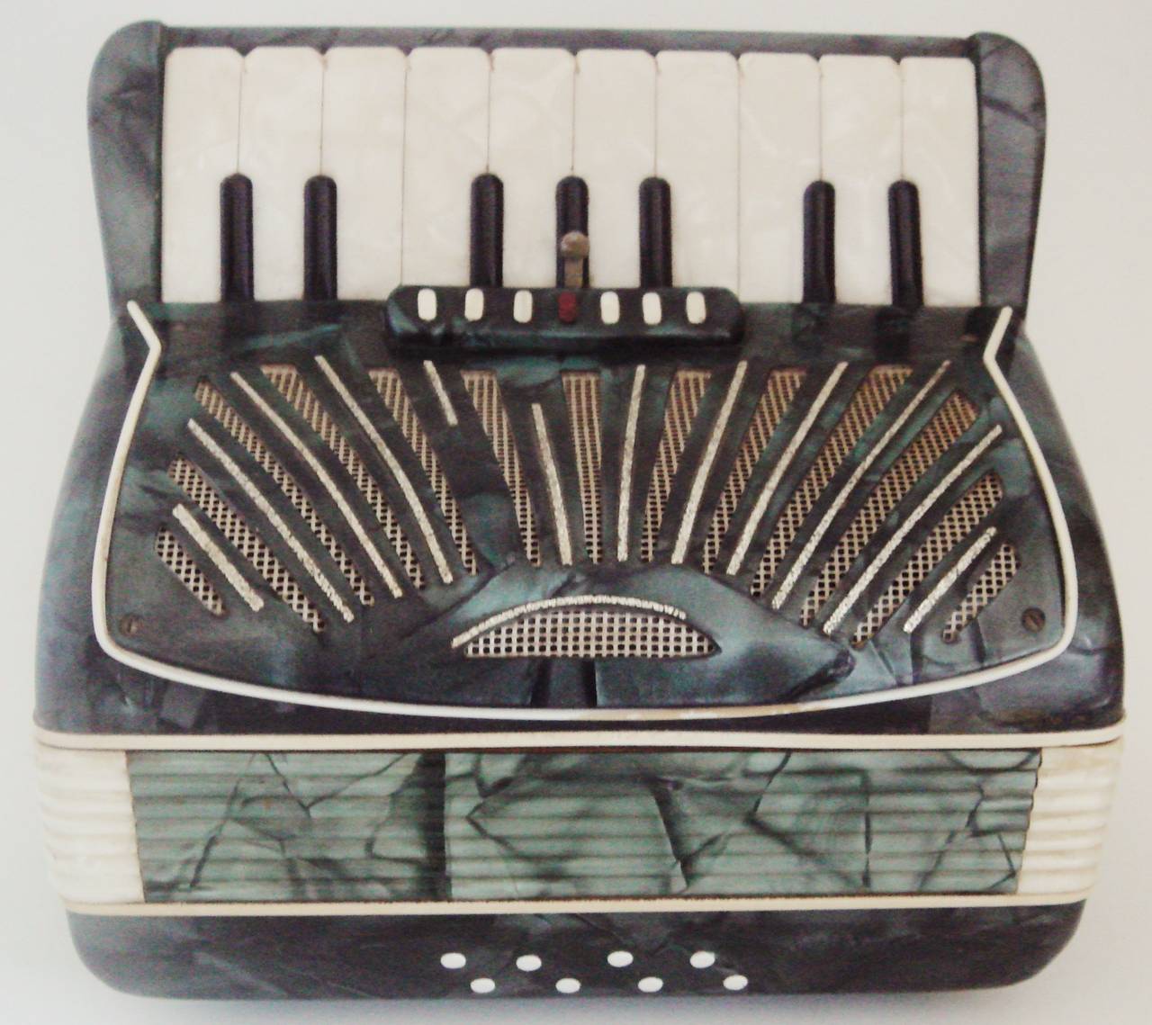 These beautiful Italian Art Deco miniature accordion shaped musical/cigarette boxes open to reveal three tiers of telescoping channels designed to hold thirty cigarettes. Their interiors are in blonde highly varnished wood with mechanical pieces