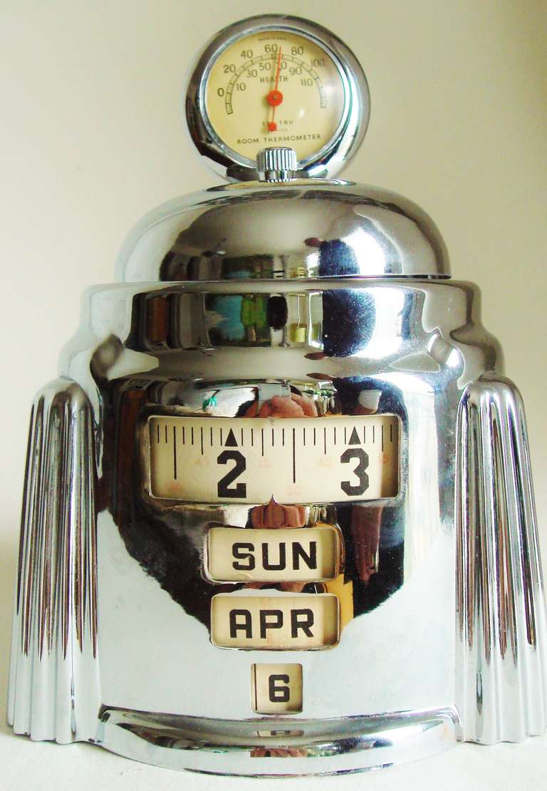 This American Art Deco Kal-Klock desk clock/calendar with top-mounted Tel-Tru room thermometer was designed and patented (Des 110,489) by Herbert W. Lamport in 1938. It would seem that he then went on to license his invention to at least three