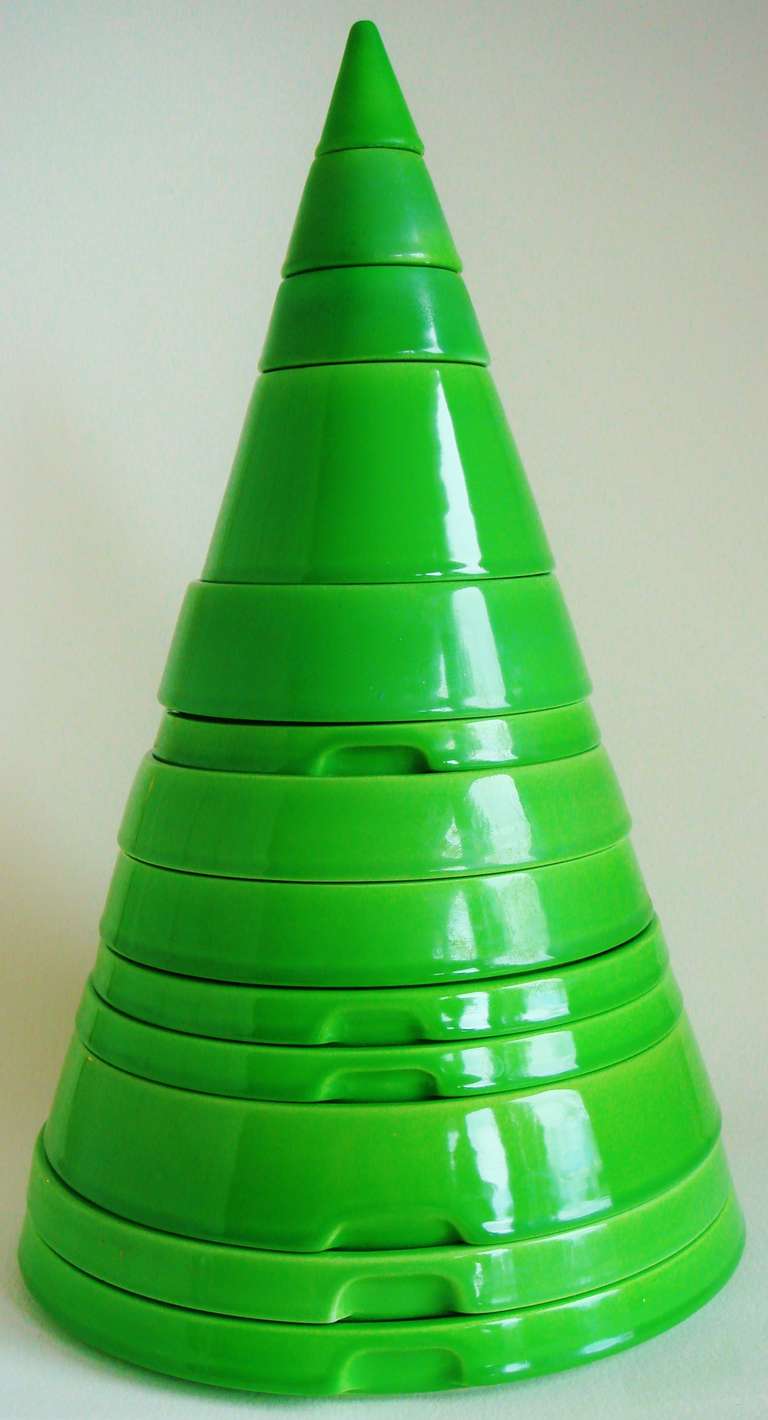 Both MoMA and Architonic attribute the design of this fabulous vibrant green stackable ceramic Cono tableware set to Joe Colombo for the Espace Pierre Cardin store in Paris in 1970. Other sources debate this, saying that it was designed by Italian