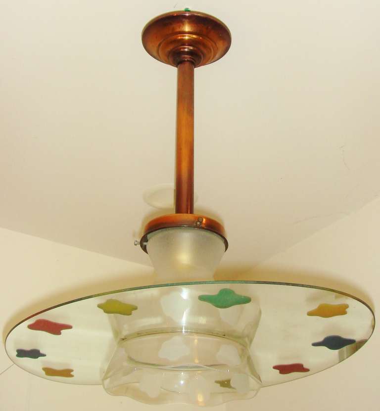 This truly eccentric French Mid-Century copper ceiling fixture features a rippled, frosted and clear glass shade with a decal edge that is decorated with sandblasted 