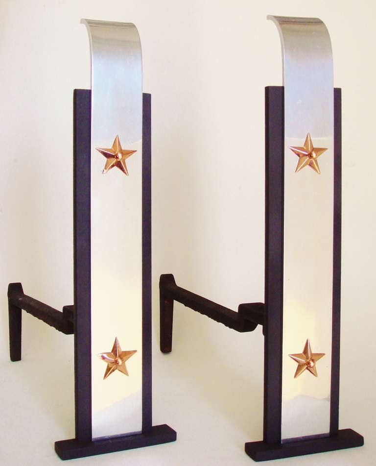 This distinctive pair of restored American Art Deco patriotic chenets/andirons each feature two copper plated stars mounted on gently curved and highly polished aluminium bases. These bases are in turn screwed to black cast iron flat stepped pillars