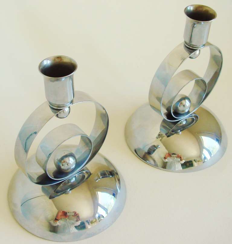 This beautiful pair of German Art Deco chrome plated metal candlesticks are not only a perfect mix of circles and spheres but are in near mint condition.