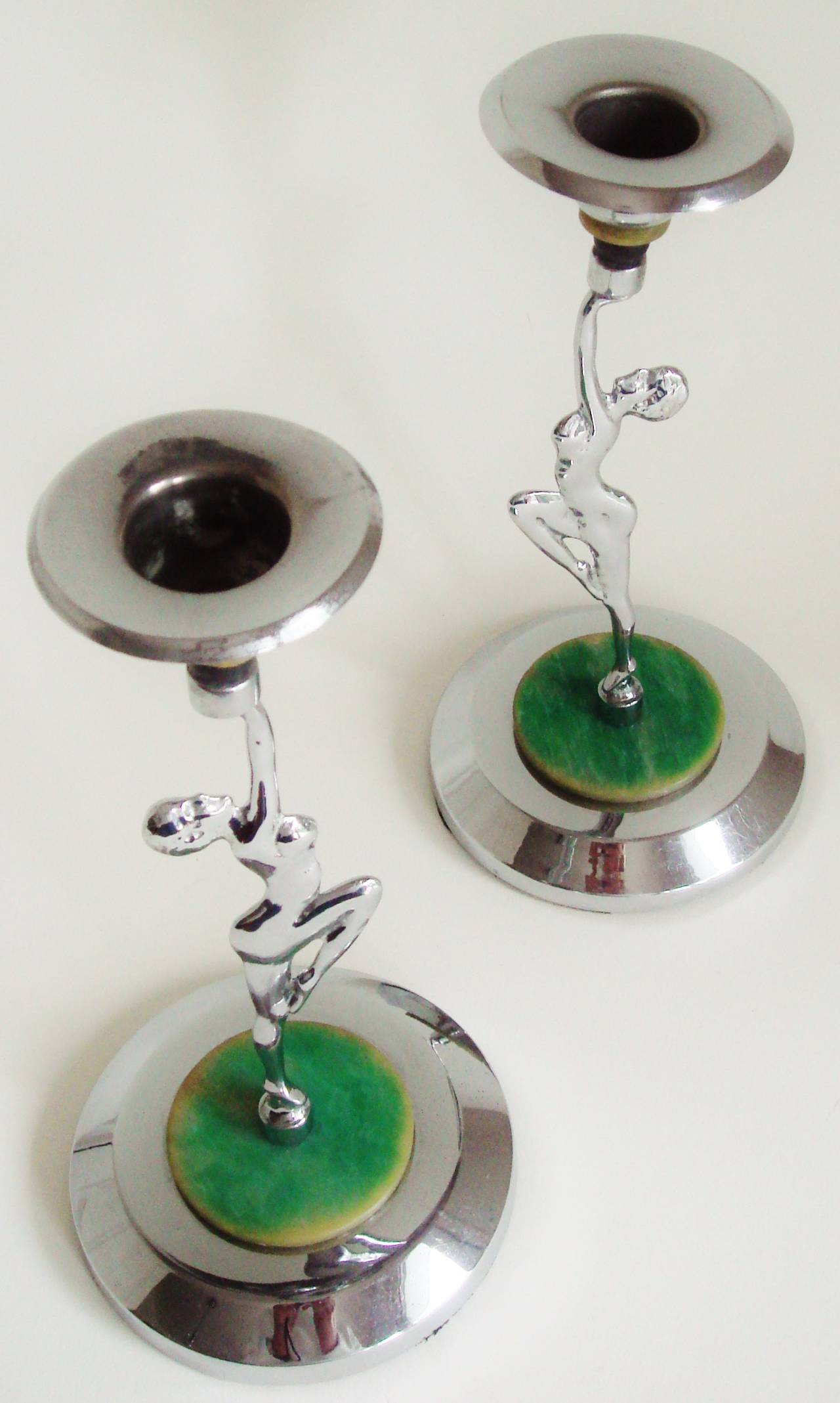 Pair of English Art Deco Chrome & Bakelite Bookended Nude Candlesticks.