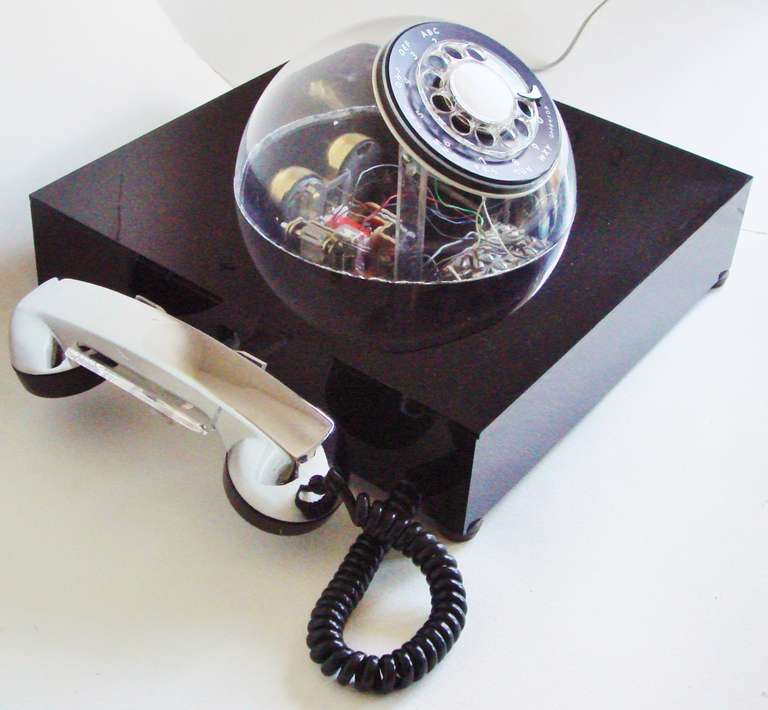 This scarce black, chrome plated and clear plastic Teledome (model # 3005) desk phone was patented in 1972 and is one of the most sophisticated models in the bizarre line-up of phones produced by the Teleconcepts Company of Hartford, Connecticut. I