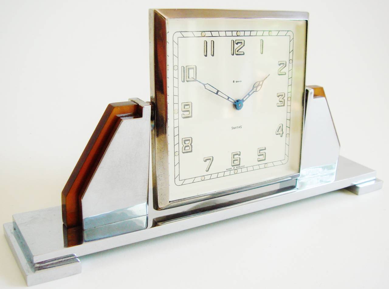 This very geometrically designed English Art Deco chrome and translucent tortoiseshell Bakelite 8-day tilting desk clock by Smiths is in near mint condition.The chrome on both the front and back shows no signs of age and the tortoiseshell Bakelite