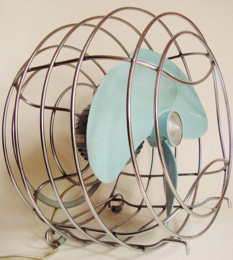 This wonderfully styled Westinghouse Ball Fan was designed by Remington Radcliffe to function either within a window housing or as a floor fan. The ball motor housing was made of pot metal and painted 