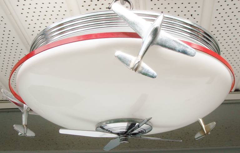 These flush mount Airplane Moelight fixtures are examples of the larger of the two sizes designed and manufactured by The Moe Brothers Manufacturing Company (formerly Moe Bridges of  Atkinson, Wisconsin). Each fixture bears the Underwriters