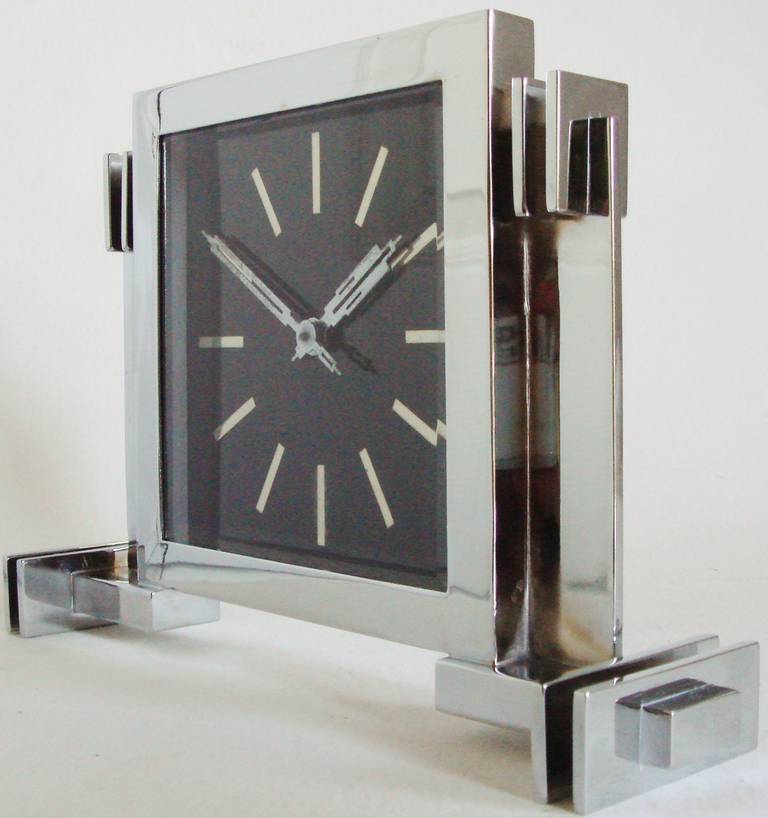 This very architecturally designed German Art Deco desk clock is boldly executed in black enamel, chrome-plate both front and back plus with stunning aluminium skeletal skyscraper hands. The clock is working well and I think that this is one of the