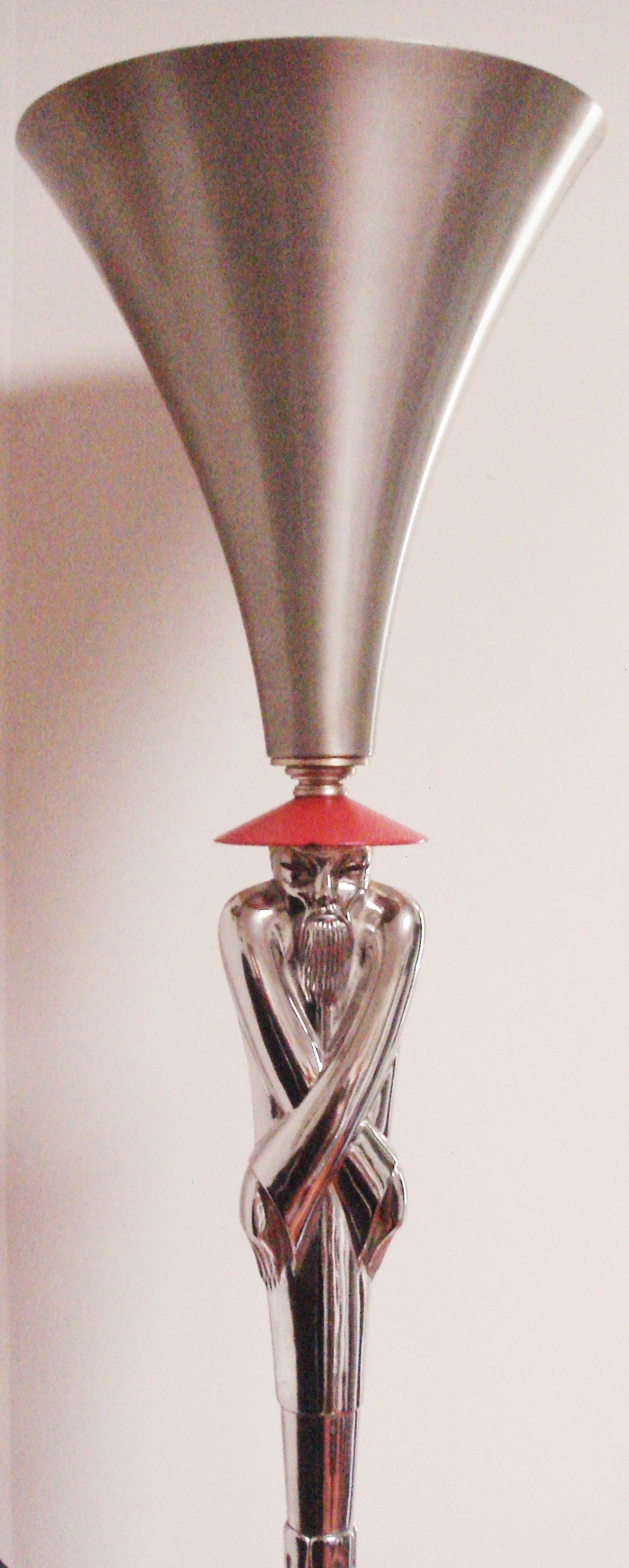This rare American Mid-Century nickel plated torchiere was designed by 