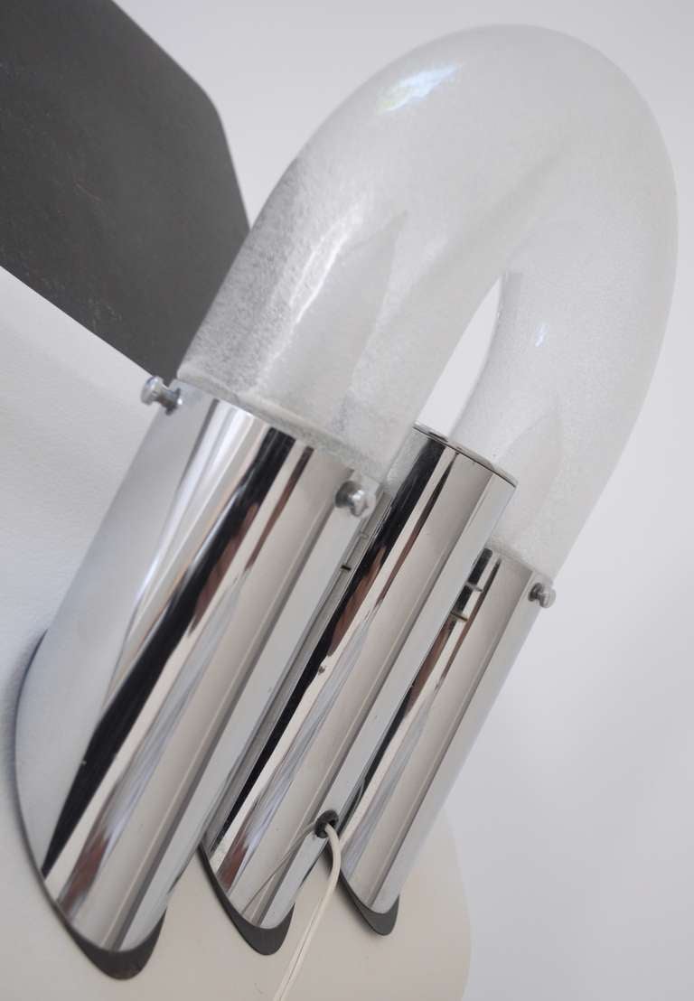 This unusual Italian 1960s modern chrome and Murano glass lamp was designed by Aldo Nason for Mazzega. It can be mounted on a wall or used on a desk/table. It is totally original, has been rewired and is in excellent condition.