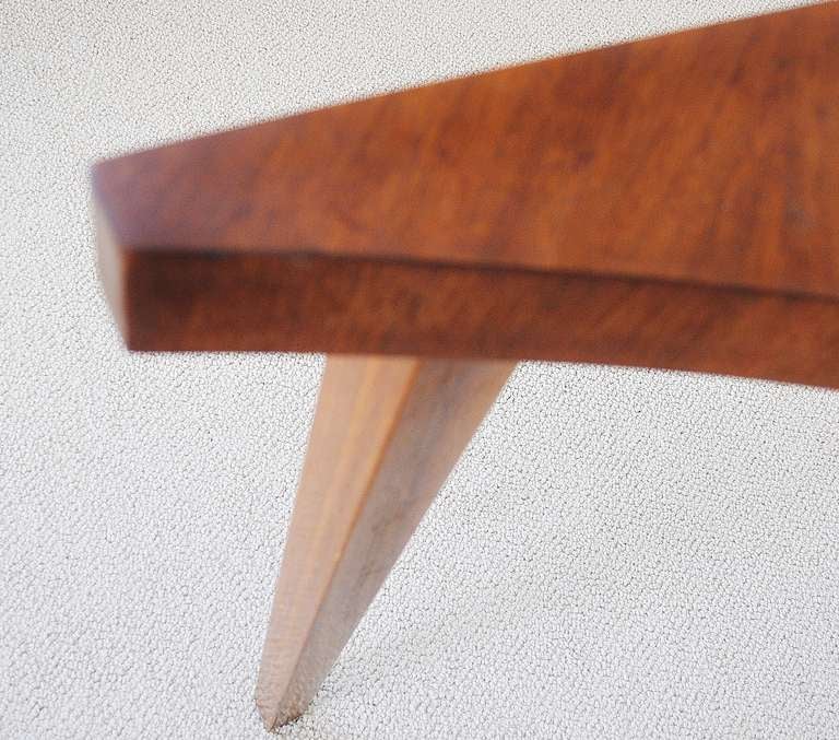 American 1960's Modern right-angled three legged corner table with concave leading edge in solid walnut stained to heighten the grain. This is the seldom seen taller version of this iconic table designed by Milo Baughman and is in great condition