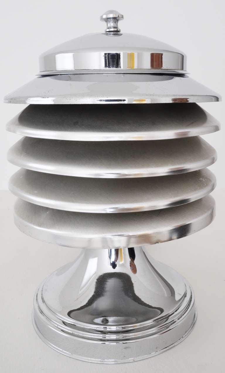 This example of the famous Canadian Coulter table lamp is in the scarce polished and brushed aluminum finish. It has five tiers, has its original finish, bears the Coulter, Toronto decal to the base and has been rewired.