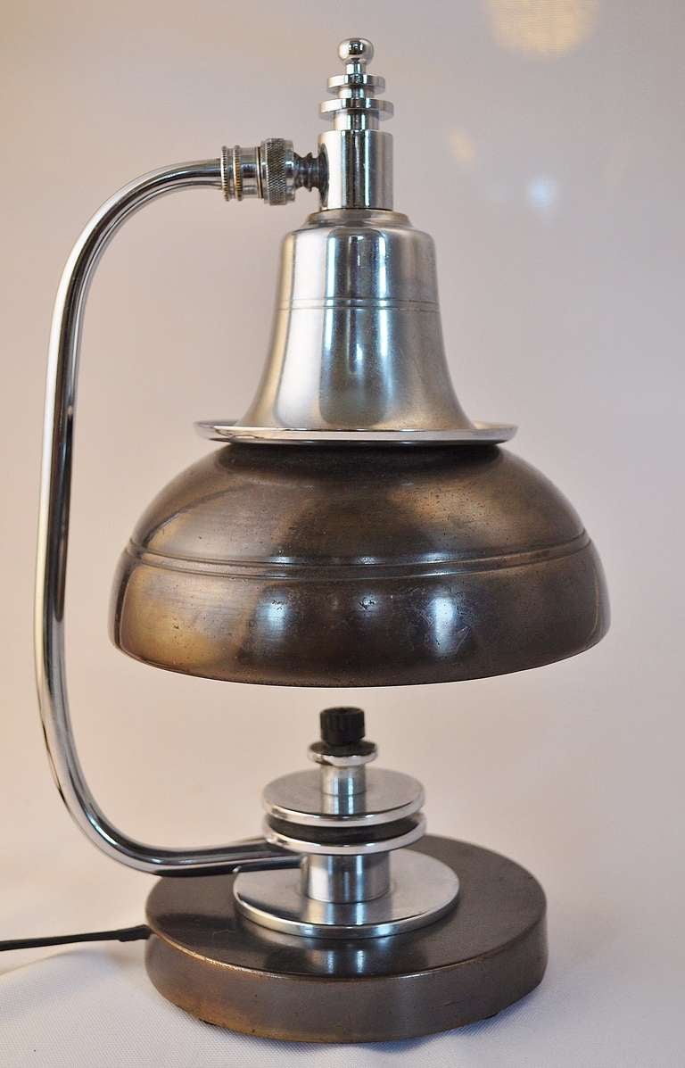 A near mint example of this bijou twin shade classic by the Markel Corporation of Buffalo NY. It retains all its original features i.e. its signature Markel straight edged disk finial, its factory original copper wash finish, its bright and original