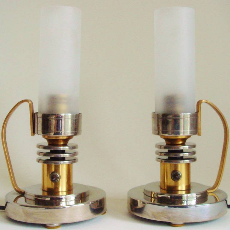 This wonderful and very rare pair of bookmarked American Art Deco chamber-stick styled boudoir Lamps by the Markel Corporation would not look out of place in Buck Rogers boudoir! Indicating that this pair of Buffalo born lamps made it across the
