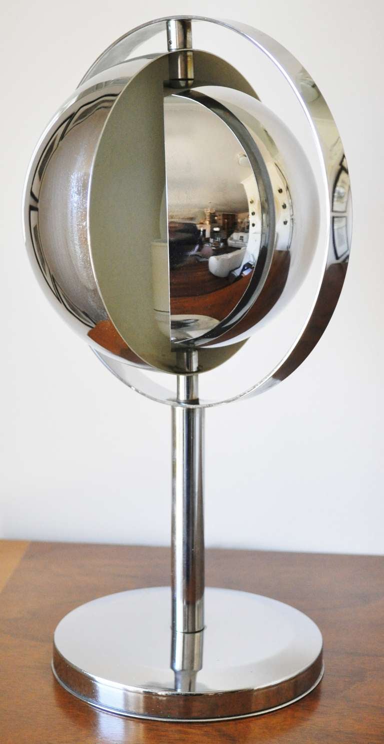 French Mid-Century Saturn shade chrome lamp. By turning the half sphere shades the amount of light can be controlled. The lamp has been rewired but maintains its original white inline switch.